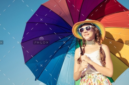 demo-attachment-35-teen-girl-with-umbrella-standing-on-the-beach-at-PMEQ6S8