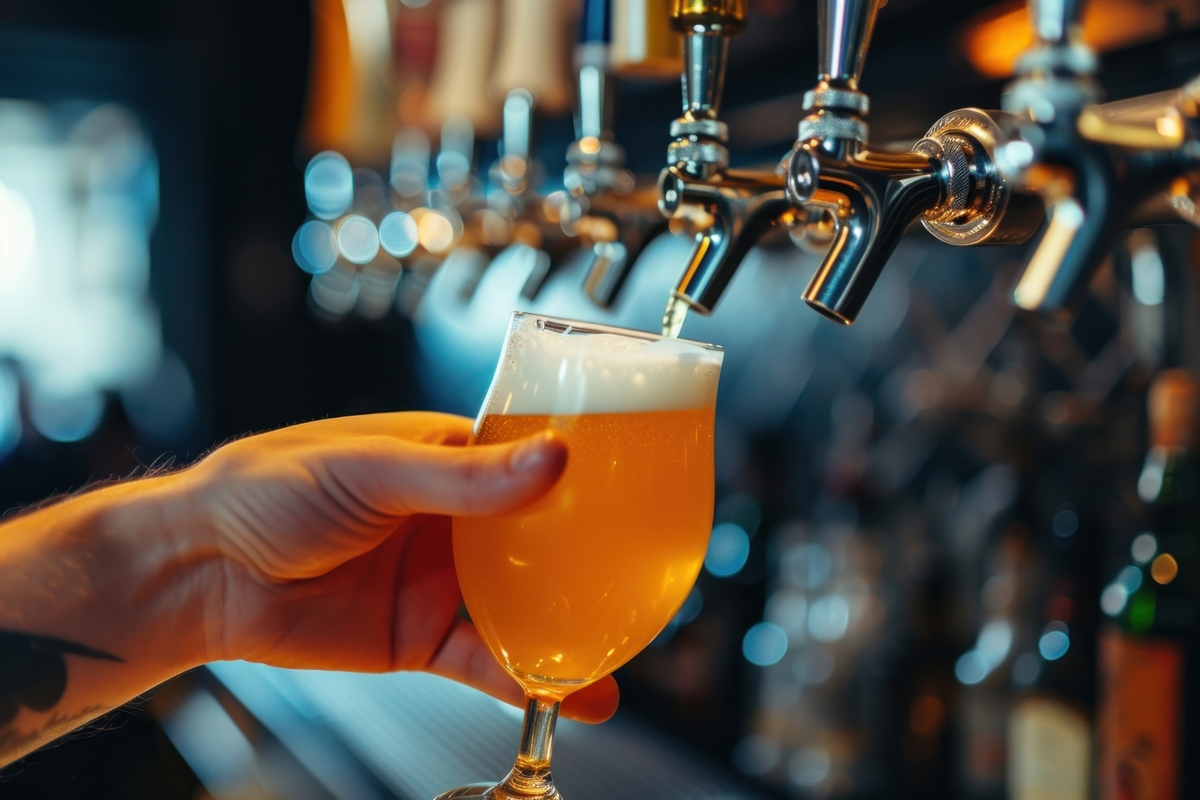 Craft beer glass pouring drink.